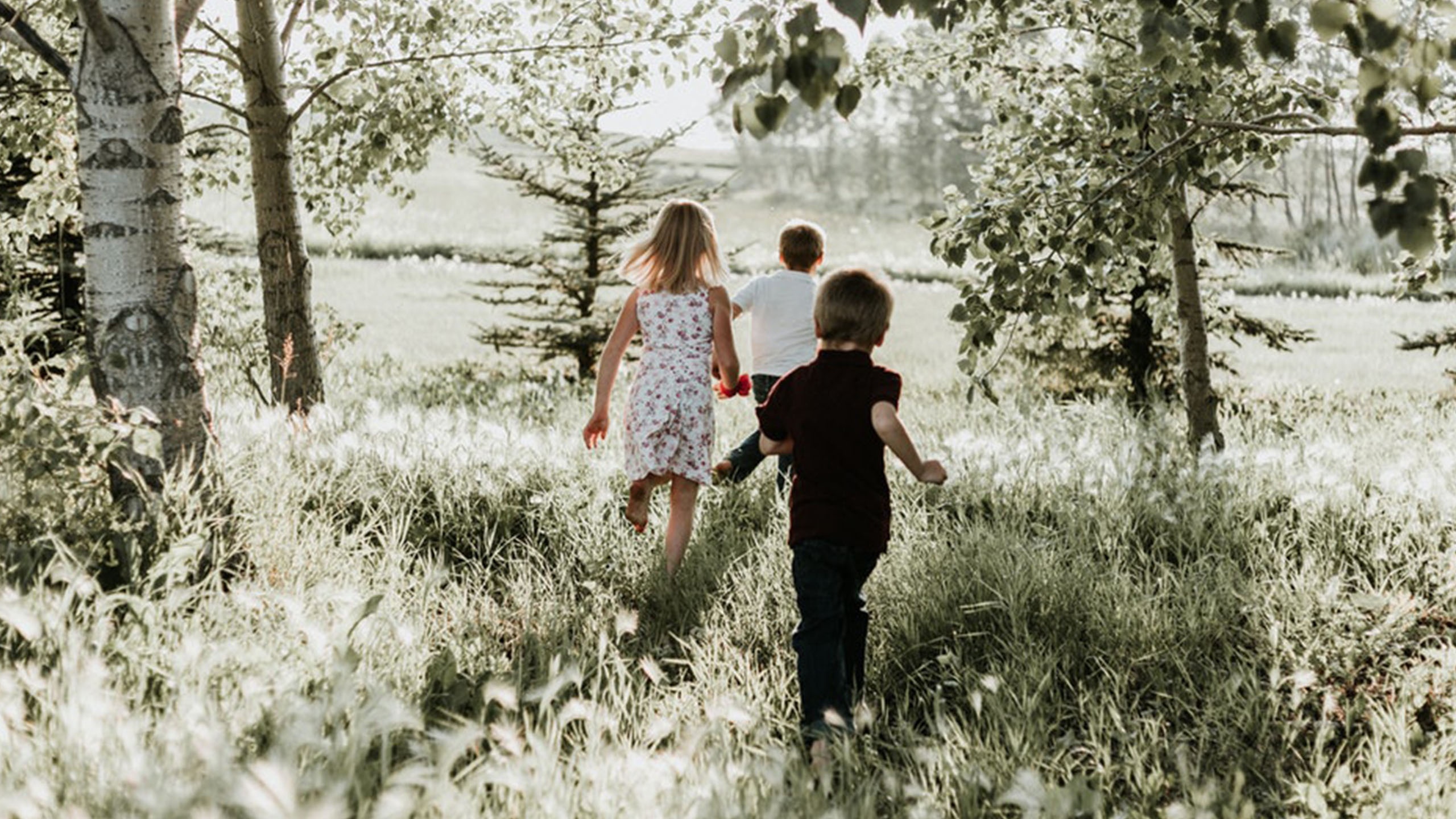 Kids running in field